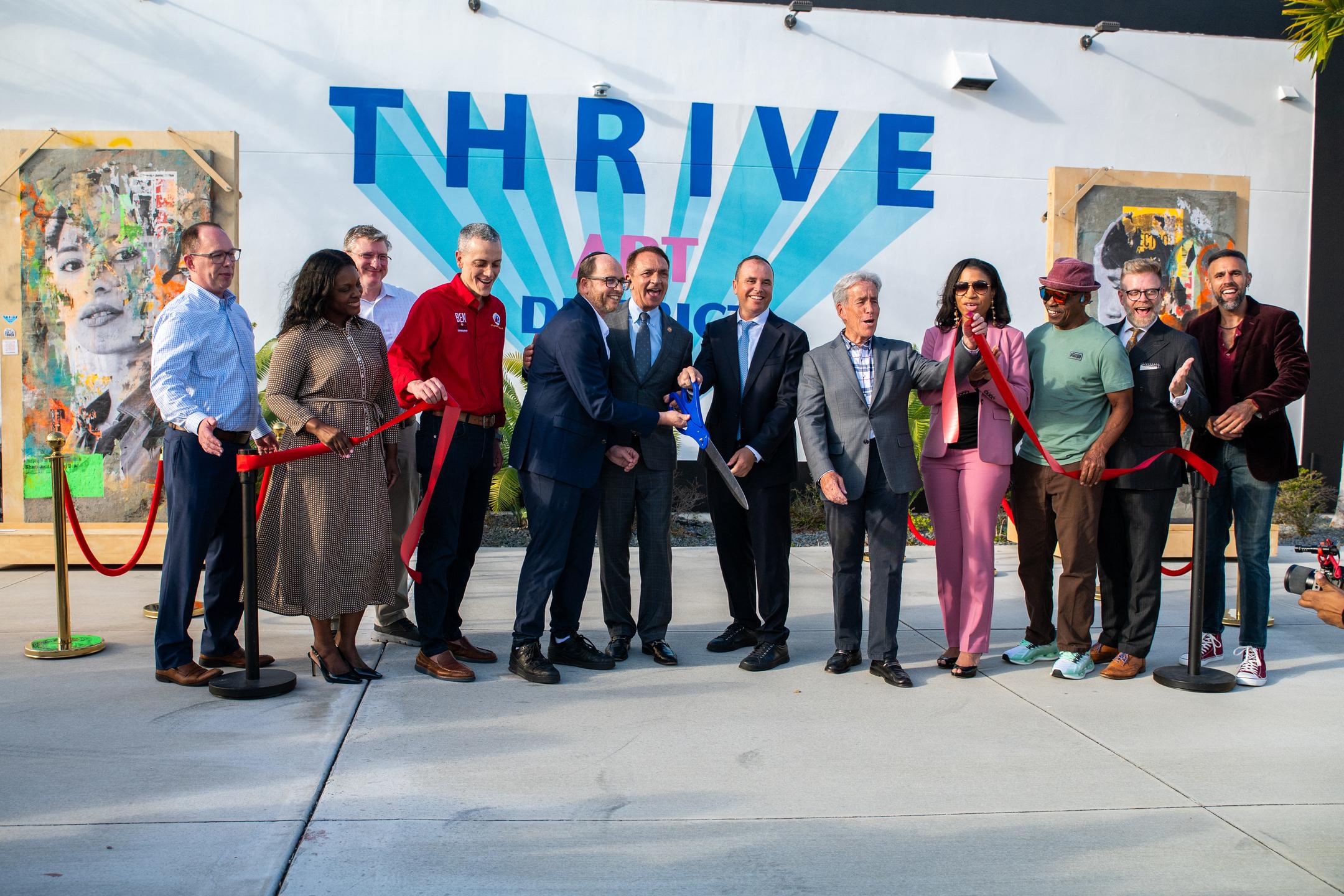 The community celebrates at Thrive District's ribbon cutting
