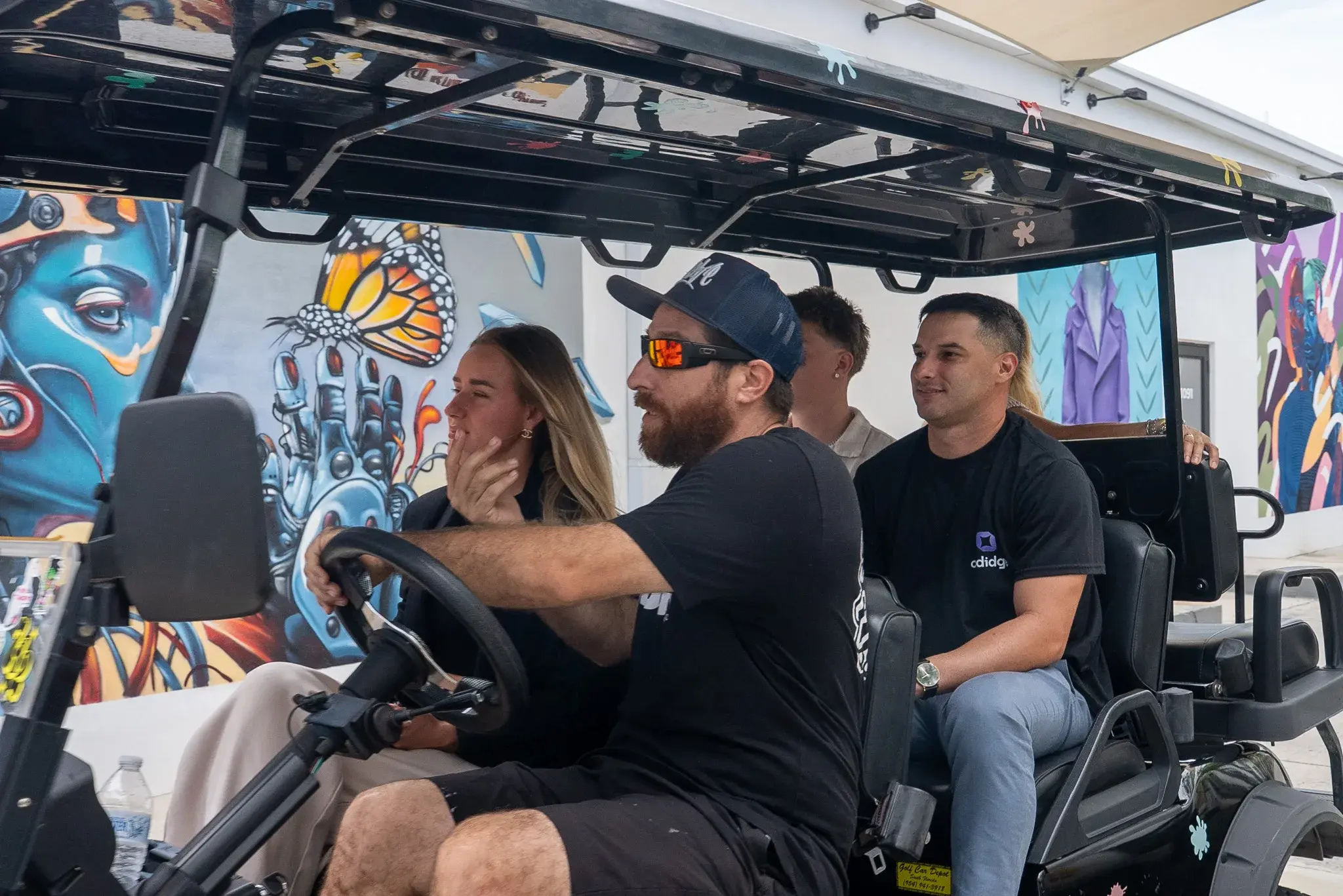 Buggy tour passing district artwork