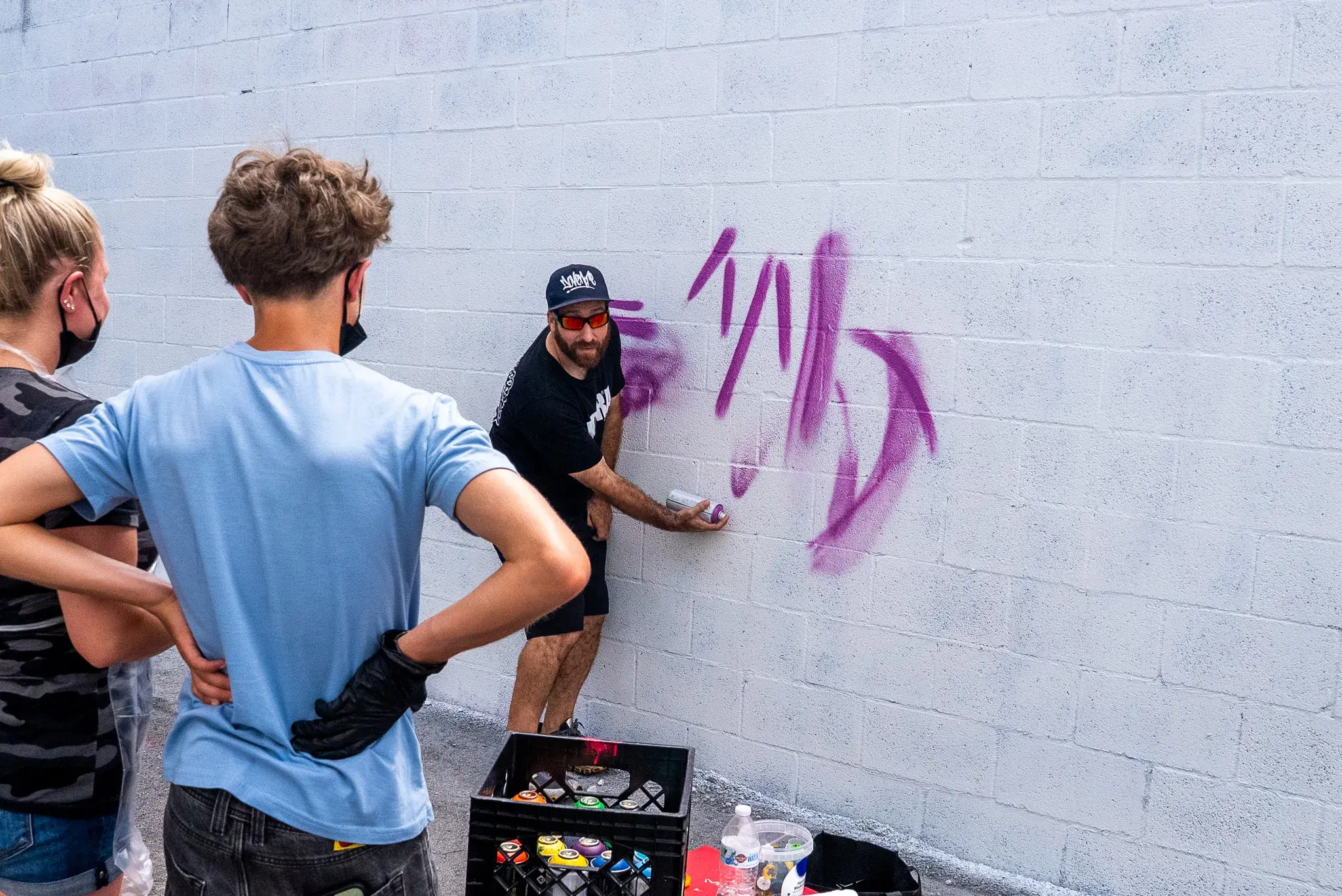 Guests learning a graffiti art class at Thrive District