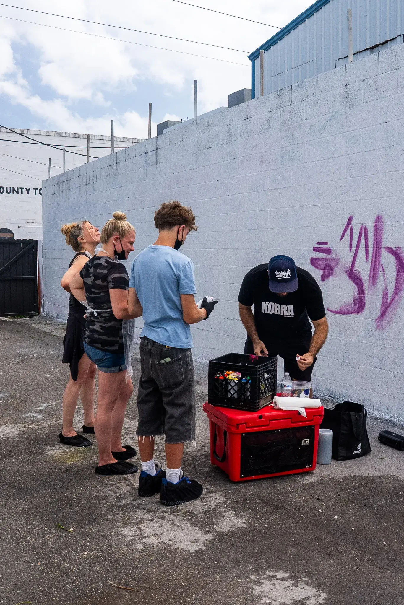 Graffiti class guest holding spray paint
