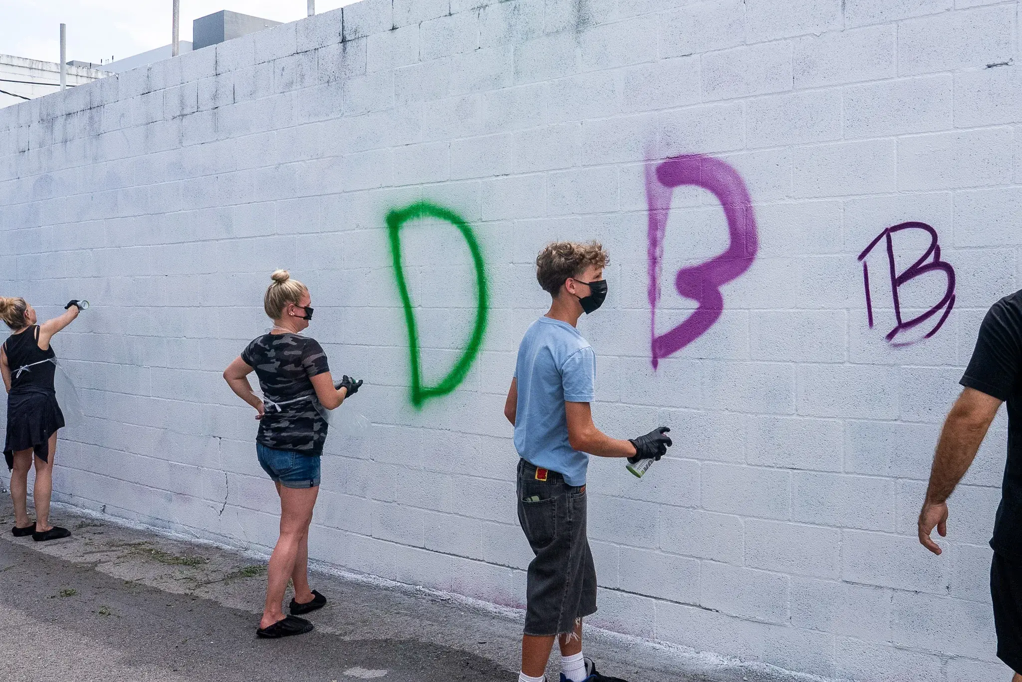 Hands on spray paint class inside Thrive District