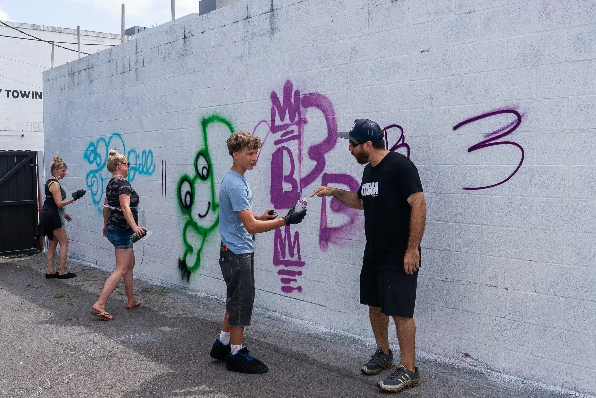 Graffiti art class with guests painting together
