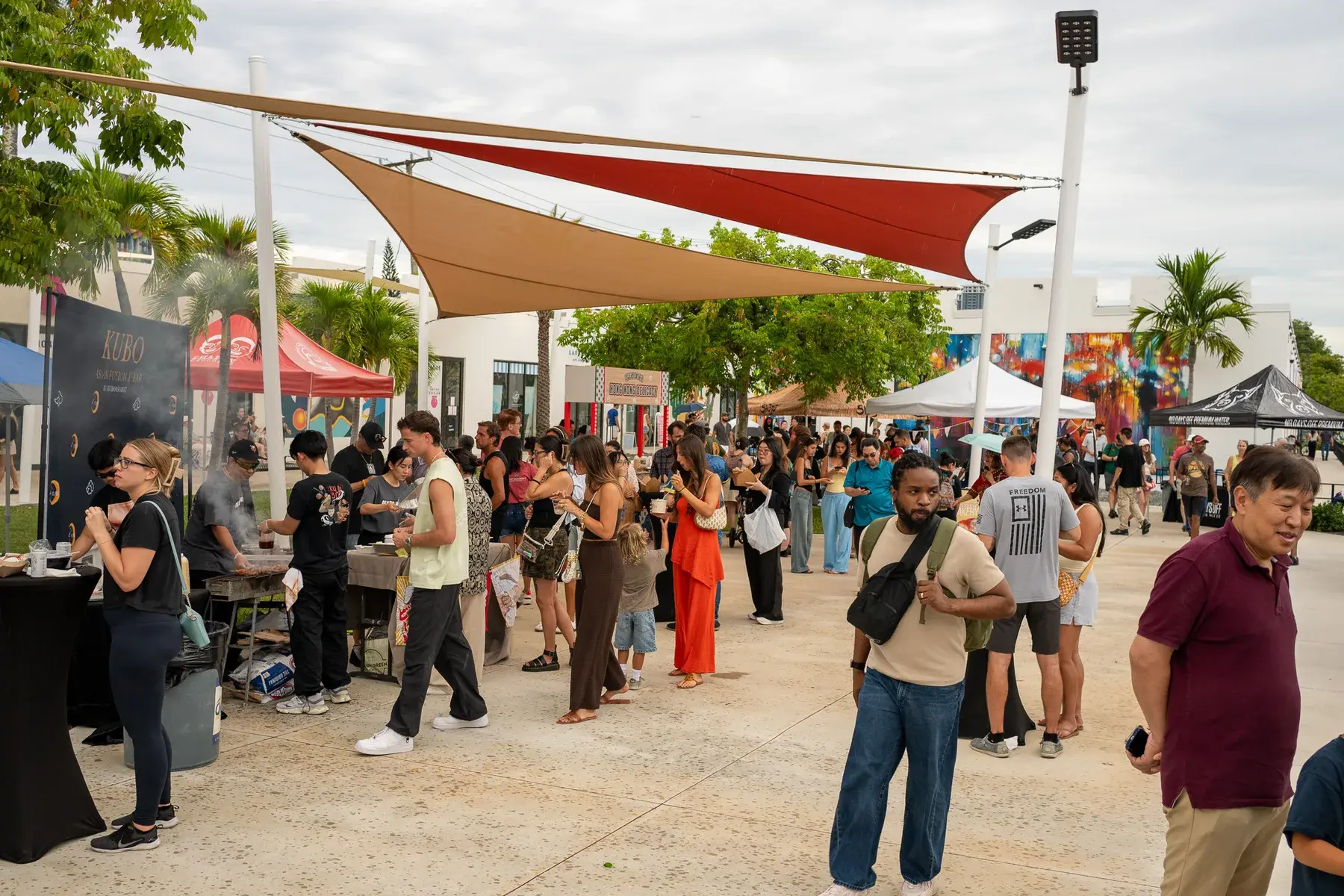 Crowd walking through Thrive District's outdoor market