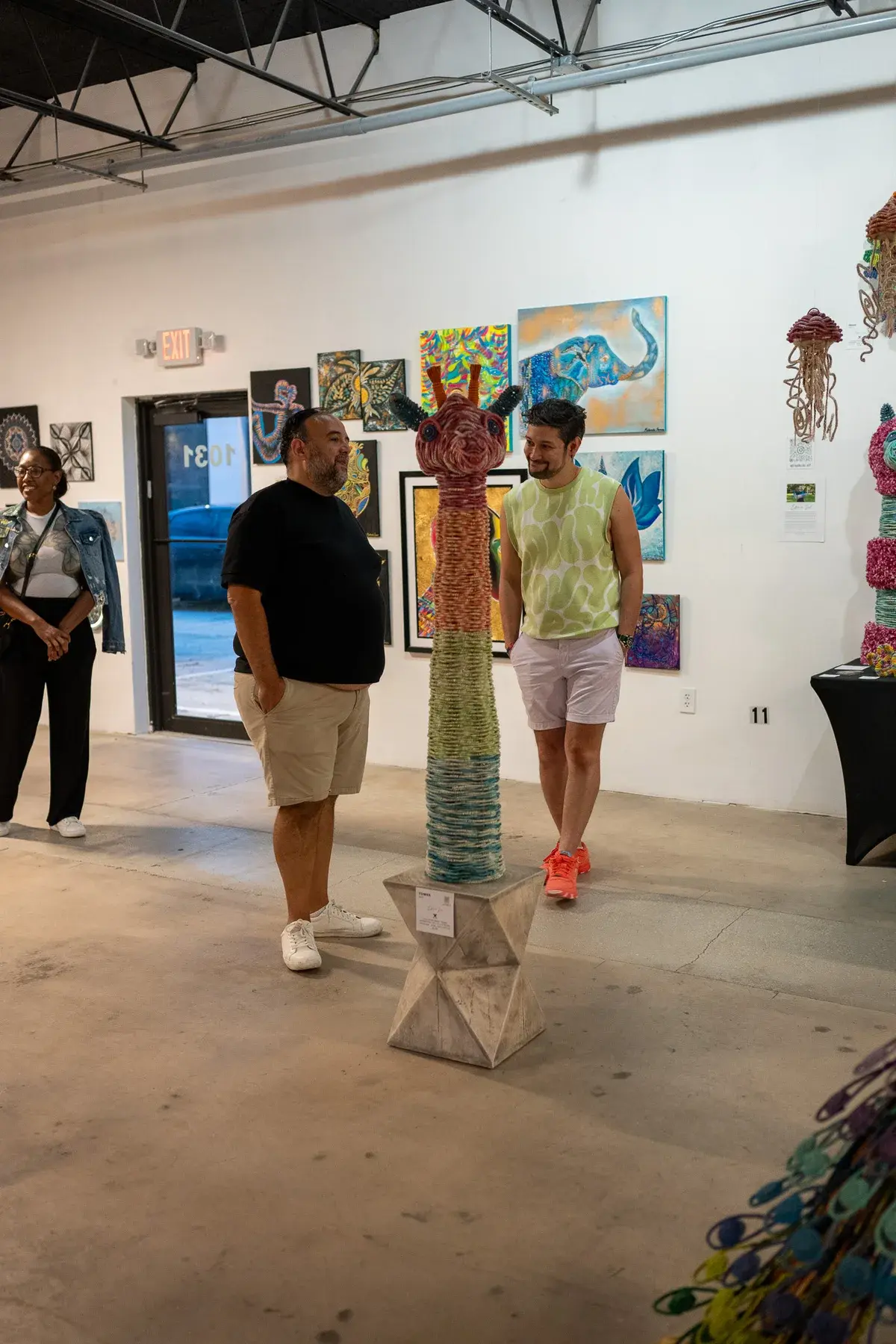 Visitors walking through a Thrive District gallery