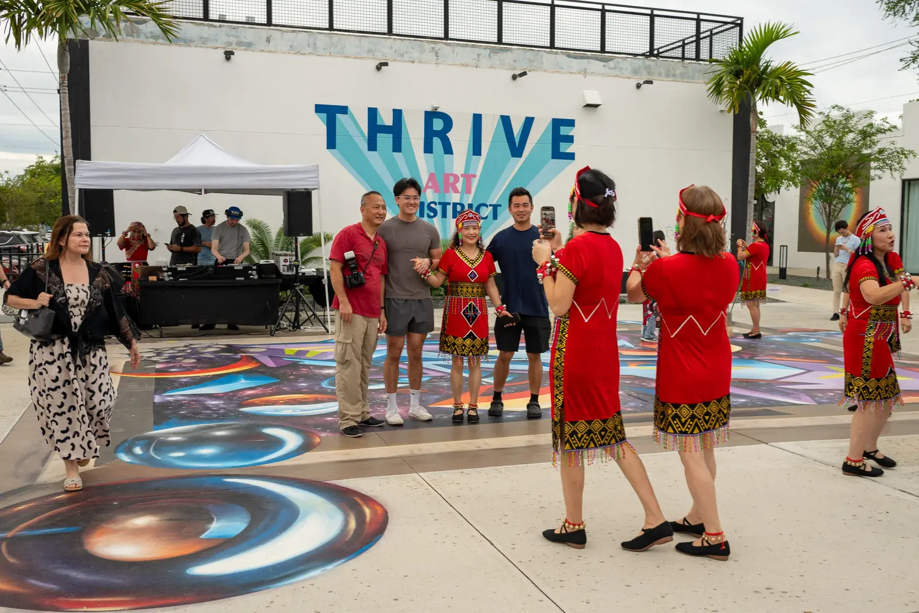 Live performance in front of the Thrive District mural wall