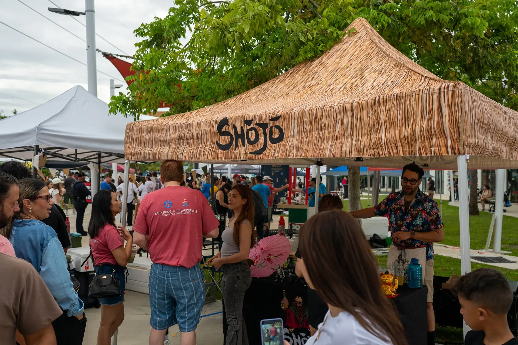 People browsing vendor tents at Thrive District