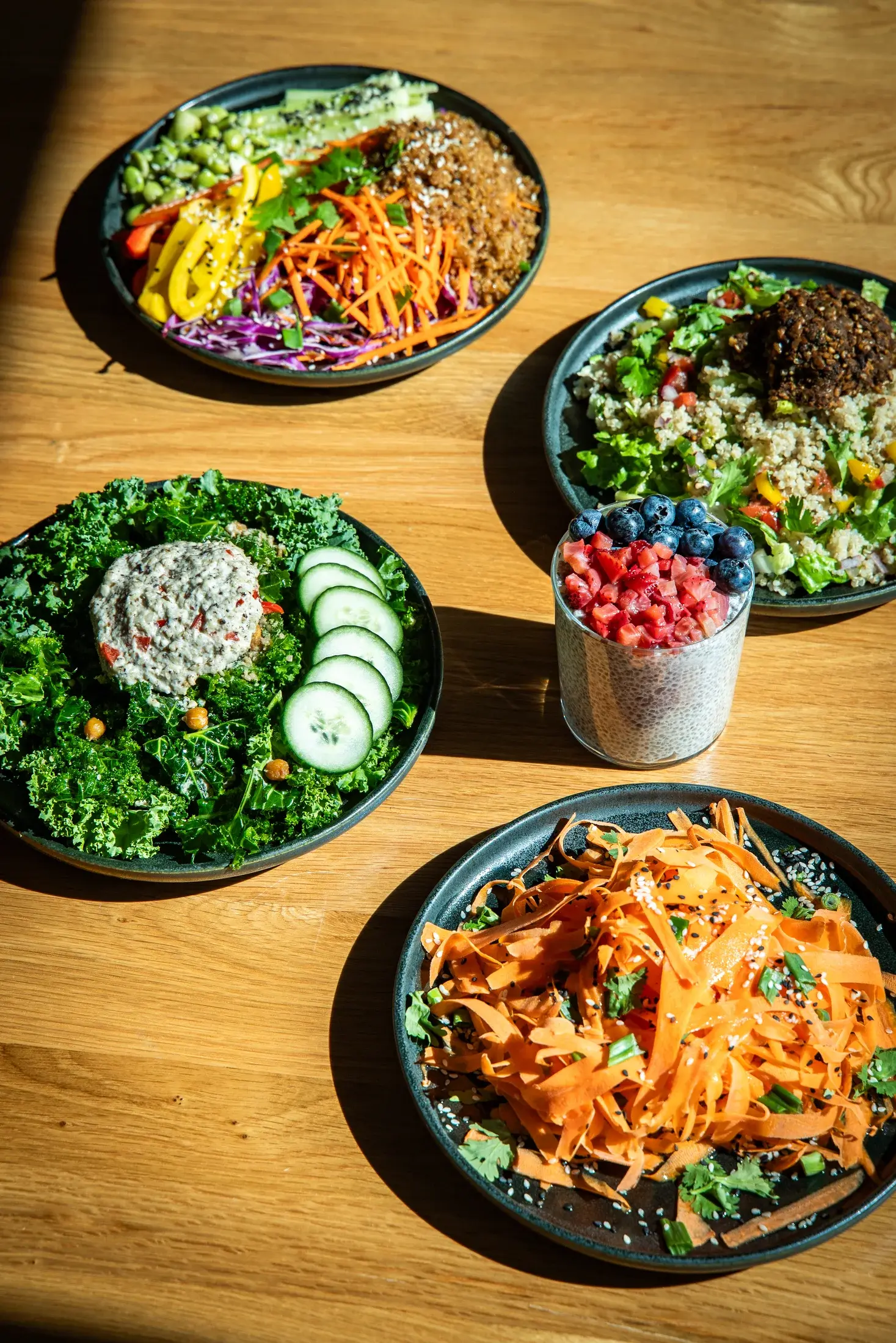 Cafe plates and chia pudding on the Alma Matcha table