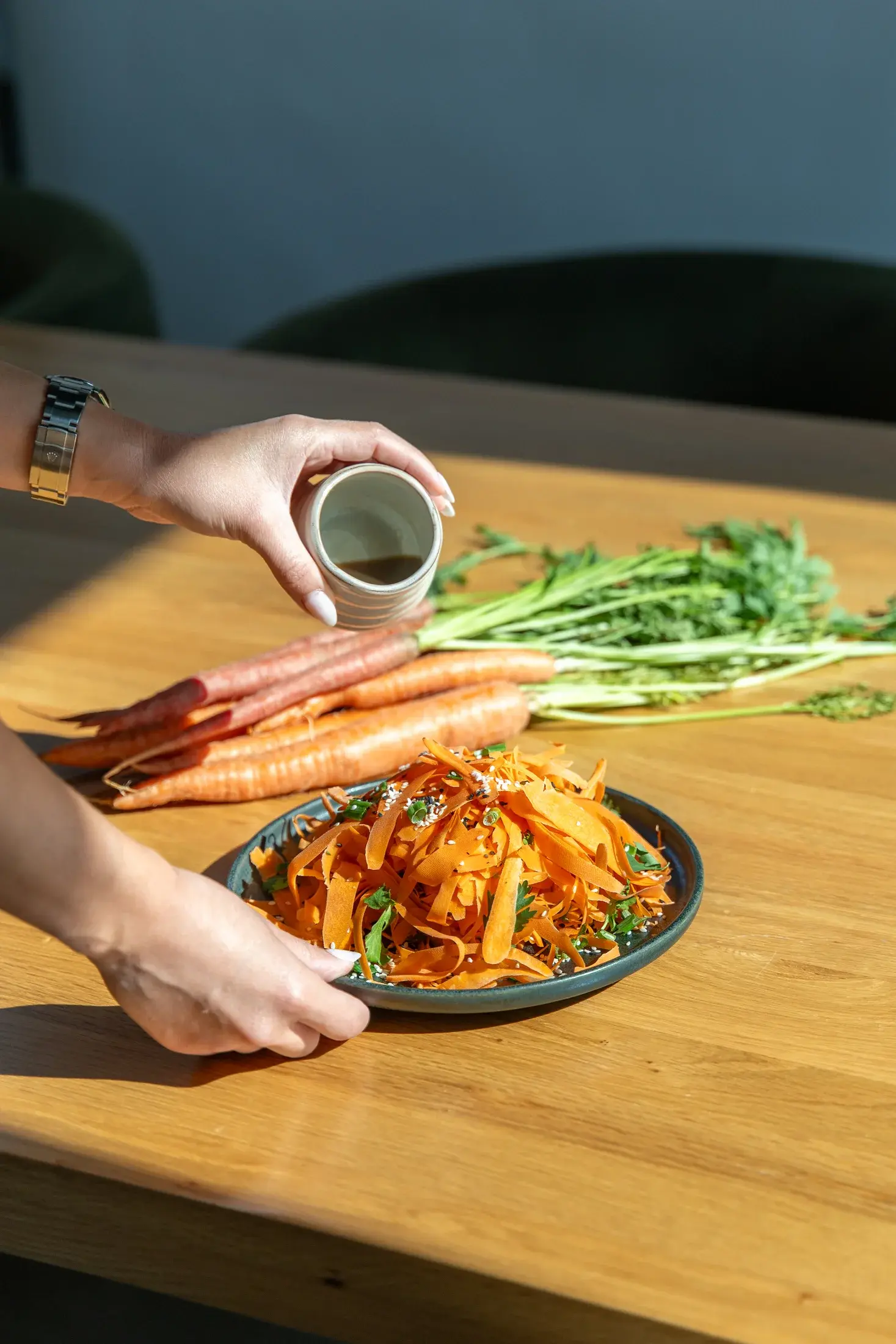 Carrot salad being dressed at Alma Matcha