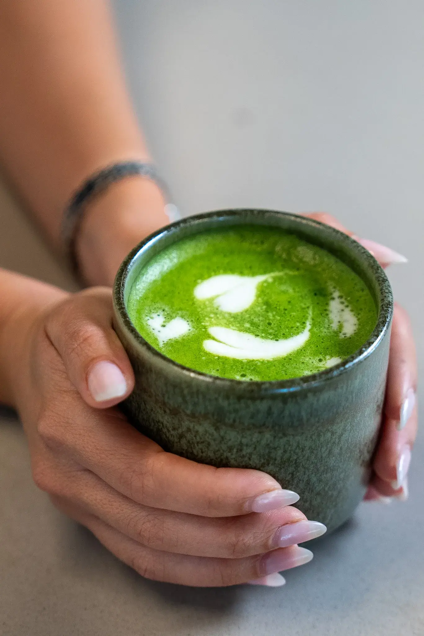 Warm matcha latte served in a ceramic bowl