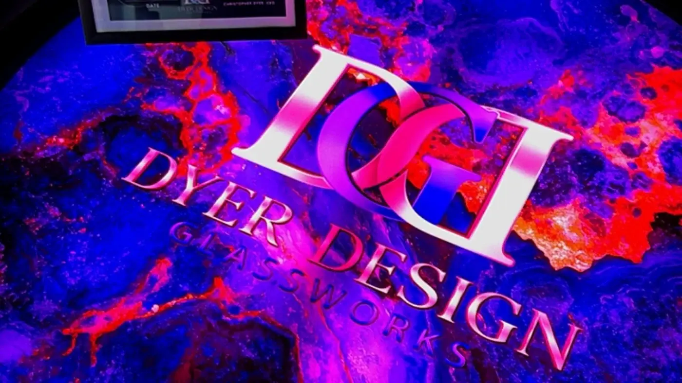 Illuminated glass table with purple and red marbling by Dyer Design Glassworks